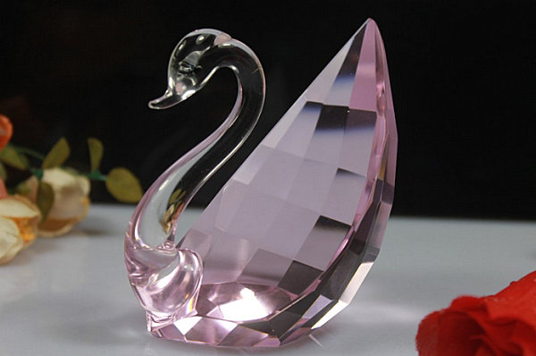 A pink-tinted crystal swan