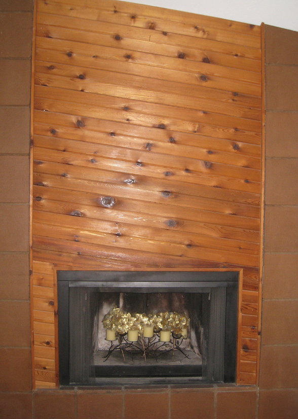 Slanted wood paneling on an '80s fireplace