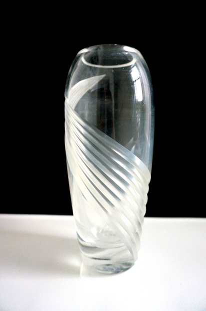 A glass vase with Deco curves