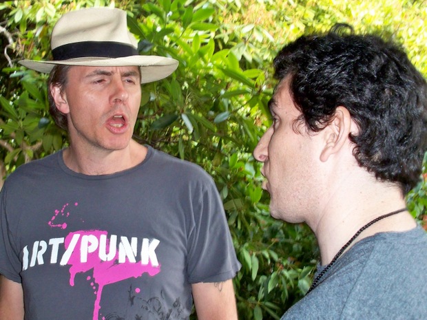 Andrew Golub conversing with Duran Duran bassist John Taylor