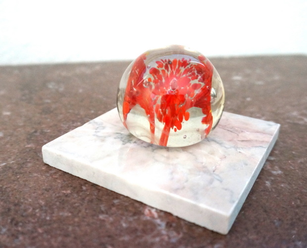 A paperweight on marble tile